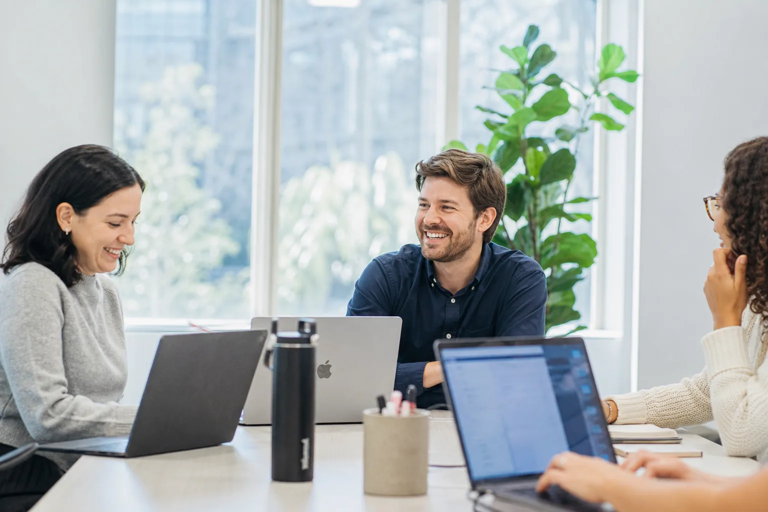 ScaleView team collaborating in a bright modern office